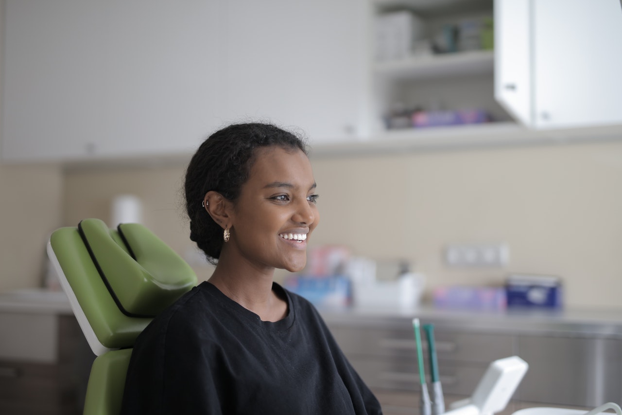 Girl smiling after dental crown procedure in Erie, PA