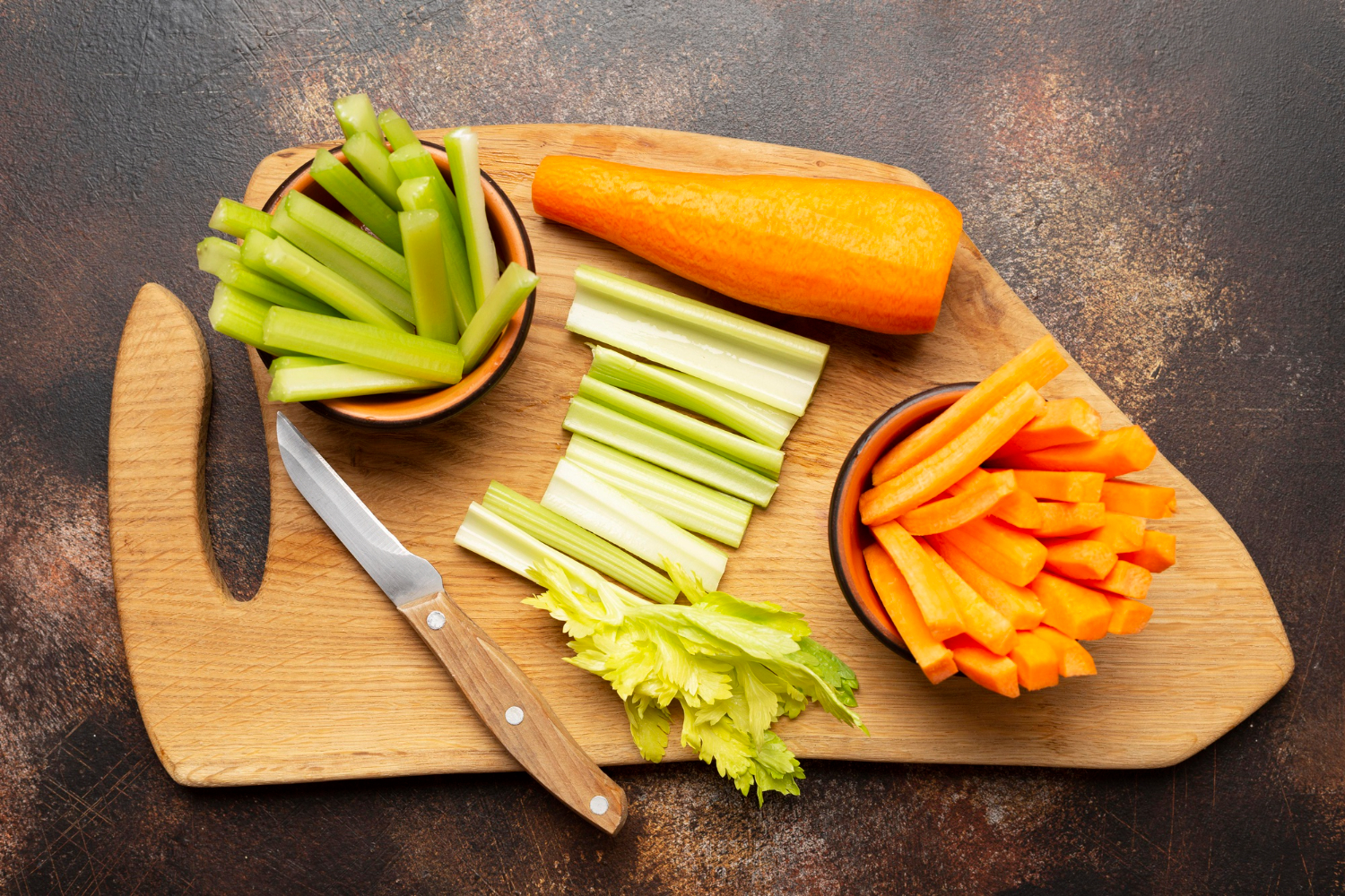 carrots and celery snacks on wooden tray best and worst foods for teeth lee simon dds