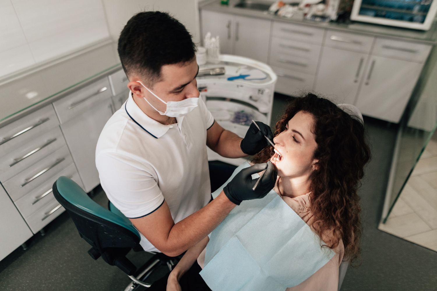 female patient in dental chair getting dental cleaning check-up lee simon dentist erie pa