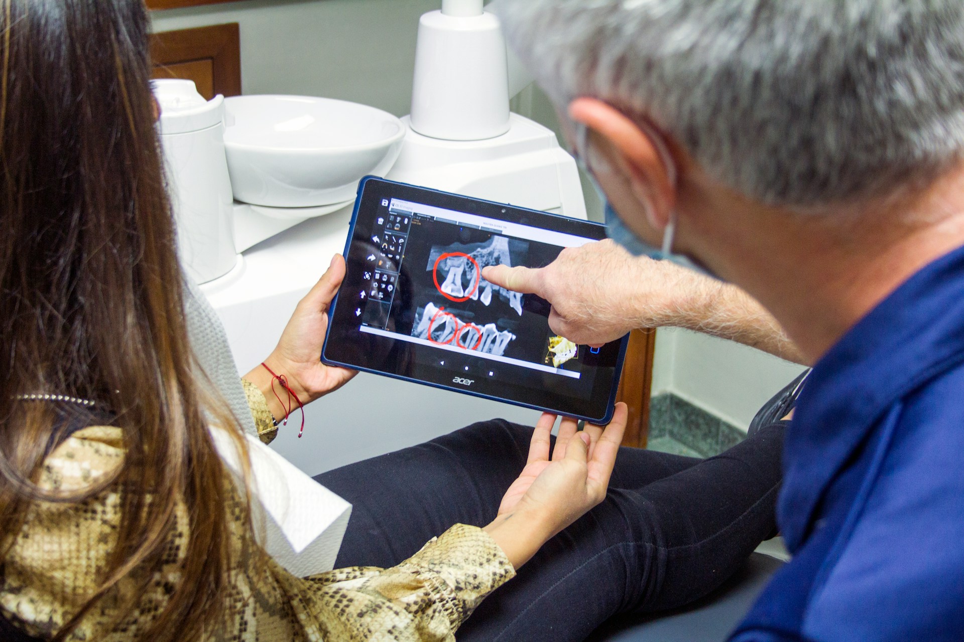 patient and dentist examine tooth x-ray lee simon erie pa